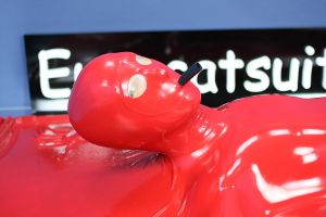 Attached made to measure latex mask in red 0.4mm latex , equipped with transparent latex lens and attached breathing hose . The vacbed remains totally airtight .
